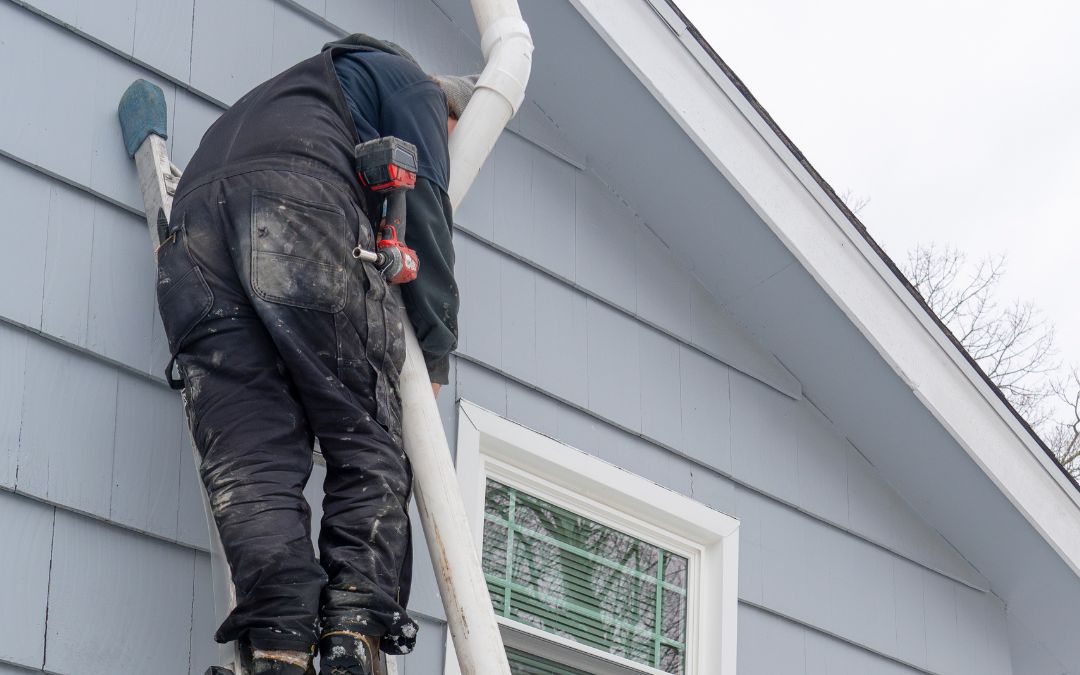 Stock image of a tech performing a radon system repair.